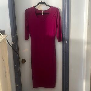 Dark fuchsia color dress. Medium/large, never worn. Mid calf length.